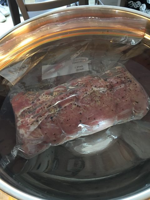 pork loin in ziploc freezer bag in water bowl water displacement technique
