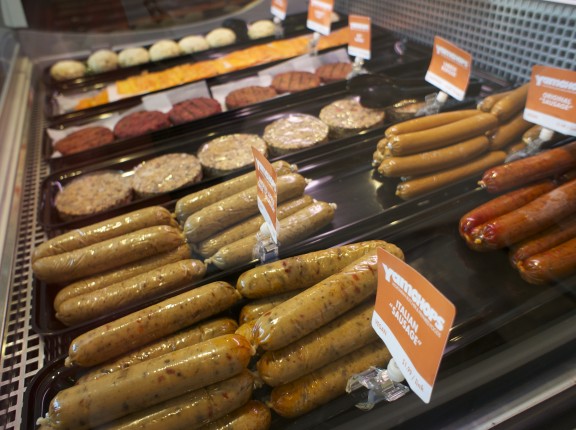 Meat-less BBQ products including "Smoked Apple and Sage Sausages" and "Beet Burgers"